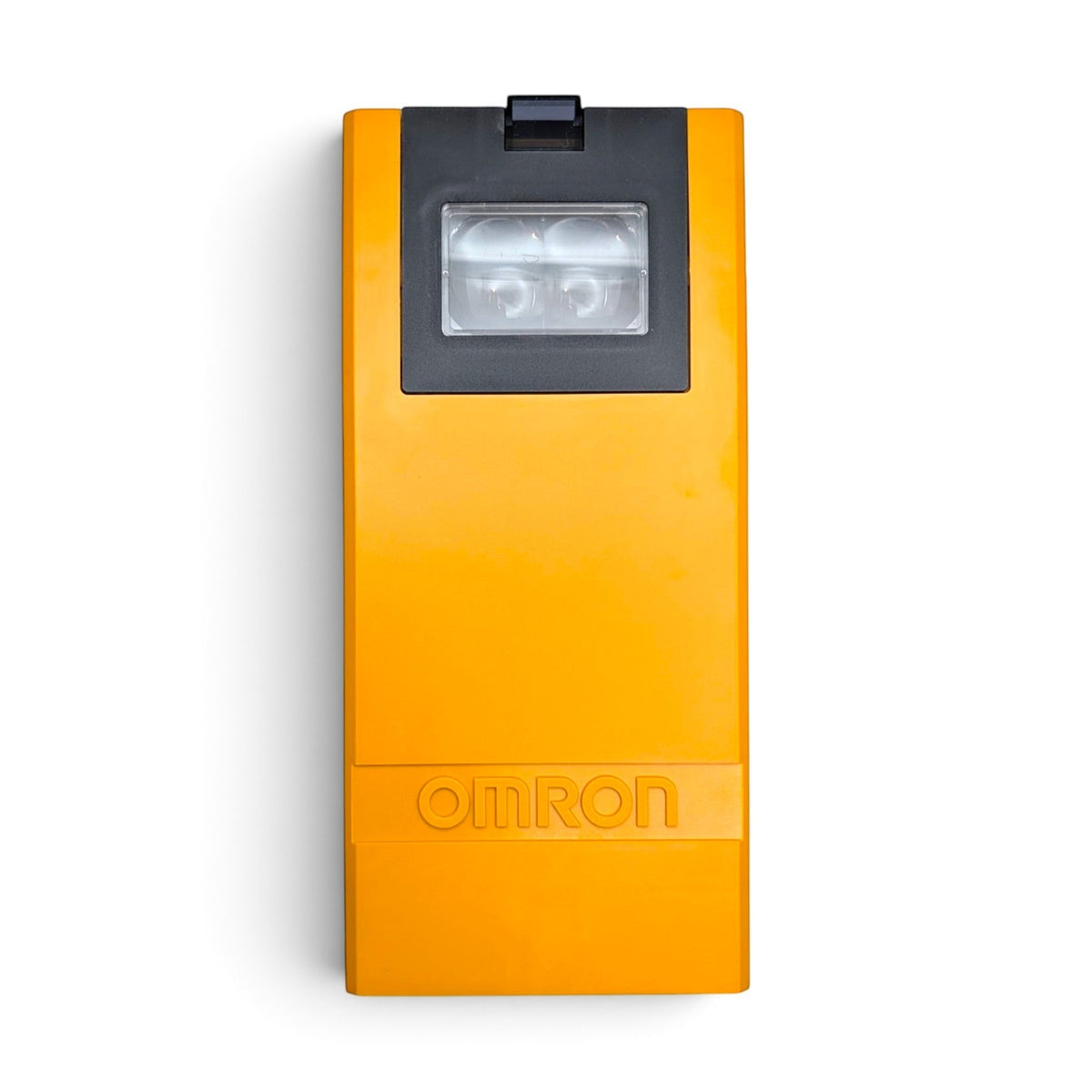 Omron E3K-R10K4-NR-1 photo eye side profile in yellow-orange plastic housing